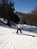 Amy Goodwin in skis on a snow covered hill
