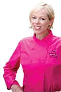 Anne Hart wearing a pink chef uniform