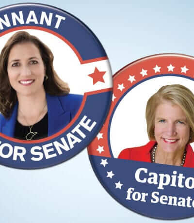 Two political buttons. One for Natalie Tennant with a photo of here stating "Tennant for Senate" and the other with Shelley Moore Capito saying "Capito for Senate"