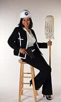 Diane Lewis sitting on a stool holding a mop
