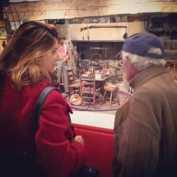 Nikki Bowman and Mike Perry looking at a historic kitchen setting