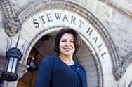 Joyce McConnell poses in front of Stewart Hall at WVU
