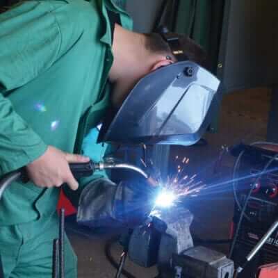 Man welding metal together